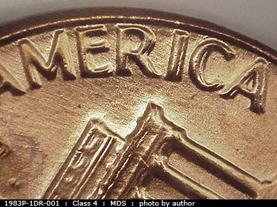 Die-stage B marker on 1983P•1DR•001 (1983 Doubled Die Reverse).
