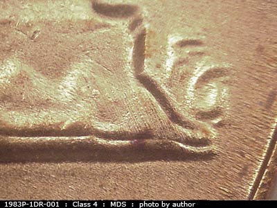 Die-stage B marker on 1983P•1DR•001 (1983 Doubled Die Reverse).