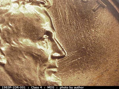 Die-stage B marker on 1983P•1DR•001 (1983 Doubled Die Reverse).