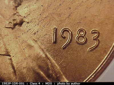 Die-stage B marker on 1983P•1DR•001 (1983 Doubled Die Reverse).
