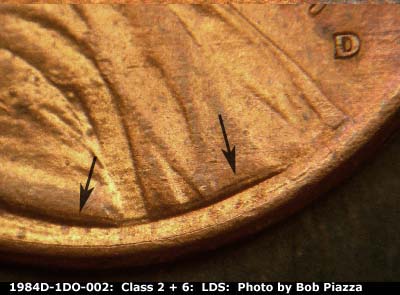 Die-stage C marker on 1984D•1DO•002 showing Doubling on base of bust.