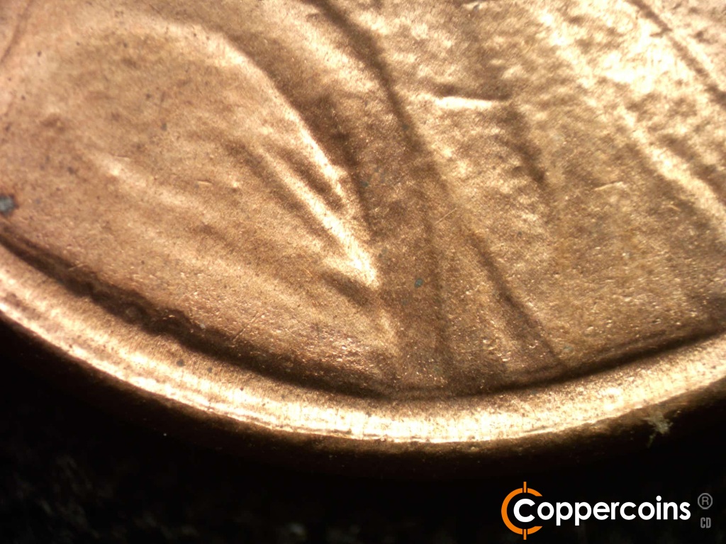 Die-stage B marker on 1984D•1DO•002 showing Doubling on base of bust.