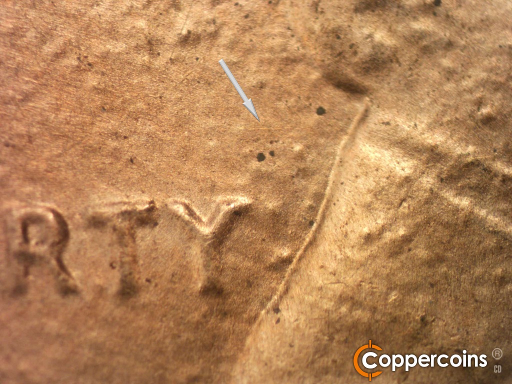 Die-stage B marker on 1984D•1DO•002 showing Light E/W die scratch above Y in LIBERTY.