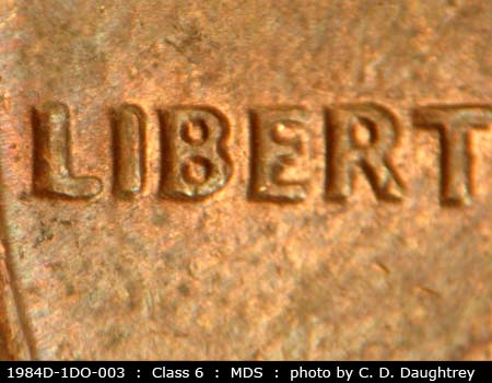 Die-stage B marker on 1984D•1DO•003 (1984 Doubled Die Obverse).