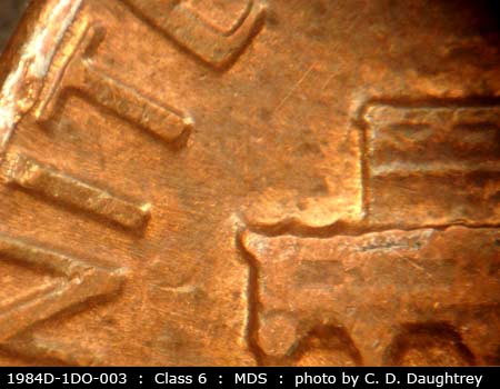 Die-stage B marker on 1984D•1DO•003 (1984 Doubled Die Obverse).