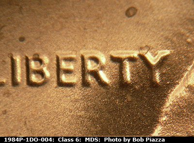 Die-stage B marker on 1984P•1DO•004 (1984 Doubled Die Obverse).