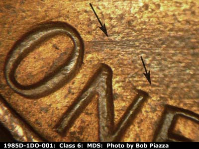Die-stage B marker on 1985D•1DO•001 (1985 Doubled Die Obverse).
