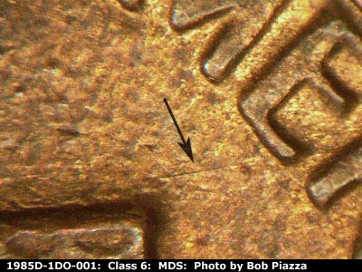 Die-stage B marker on 1985D•1DO•001 (1985 Doubled Die Obverse).