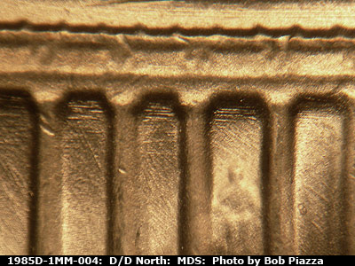 Die-stage B marker on 1985D•1MM•004 (1985 Repunched Mint Mark).