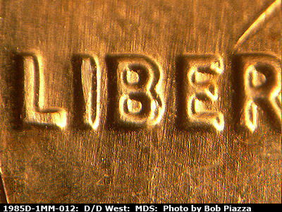 Die-stage B marker on 1985D•1MM•012 (1985 Repunched Mint Mark).