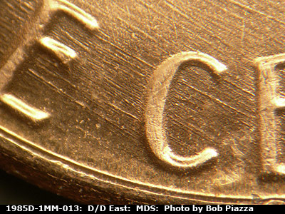 Die-stage B marker on 1985D•1MM•013 (1985 Repunched Mint Mark).