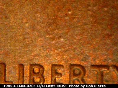 Die-stage B marker on 1985D•1MM•020 (1985 Repunched Mint Mark).