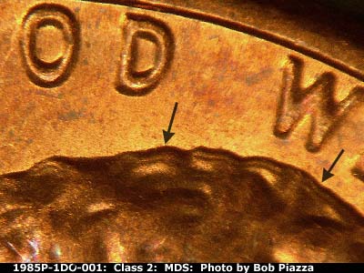 Die-stage B marker on 1985P•1DO•001 (1985 Doubled Die Obverse).