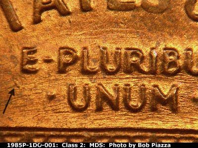 Die-stage B marker on 1985P•1DO•001 (1985 Doubled Die Obverse).