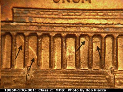 Die-stage B marker on 1985P•1DO•001 (1985 Doubled Die Obverse).