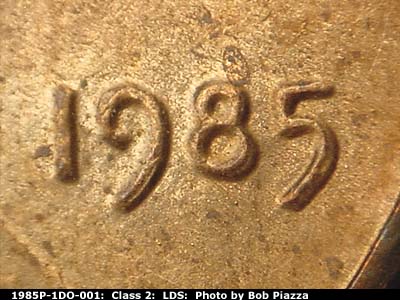 Die-stage C marker on 1985P•1DO•001 (1985 Doubled Die Obverse).