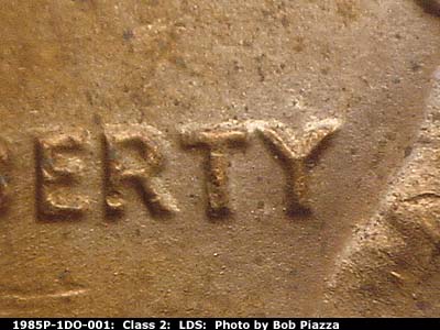 Die-stage C marker on 1985P•1DO•001 (1985 Doubled Die Obverse).