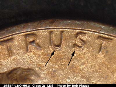 Die-stage C marker on 1985P•1DO•001 (1985 Doubled Die Obverse).