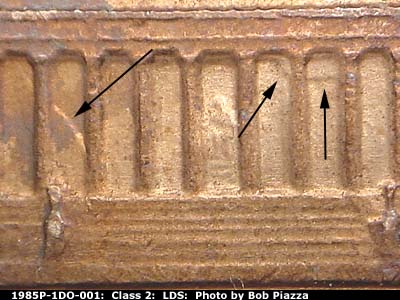 Die-stage C marker on 1985P•1DO•001 (1985 Doubled Die Obverse).