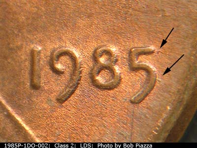 Die-stage C marker on 1985P•1DO•002 (1985 Doubled Die Obverse).