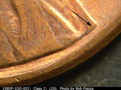 Die-stage C marker on 1985P•1DO•002 (1985 Doubled Die Obverse).