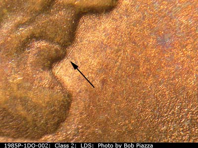 Die-stage C marker on 1985P•1DO•002 (1985 Doubled Die Obverse).
