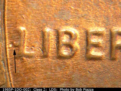 Die-stage C marker on 1985P•1DO•002 (1985 Doubled Die Obverse).