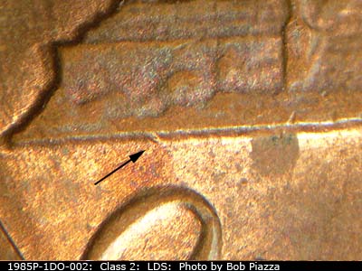 Die-stage C marker on 1985P•1DO•002 (1985 Doubled Die Obverse).