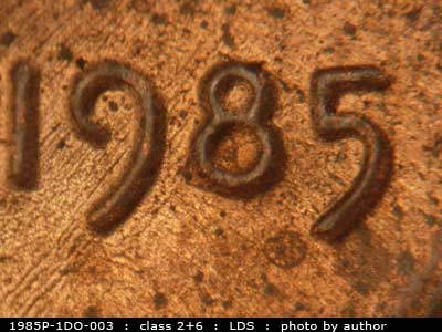 Die-stage C marker on 1985P•1DO•003 (1985 Doubled Die Obverse).