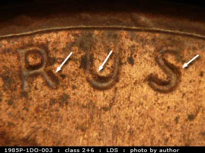 Die-stage C marker on 1985P•1DO•003 (1985 Doubled Die Obverse).