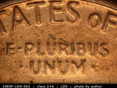Die-stage C marker on 1985P•1DO•003 (1985 Doubled Die Obverse).