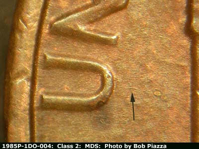 Die-stage B marker on 1985P•1DO•004 (1985 Doubled Die Obverse).