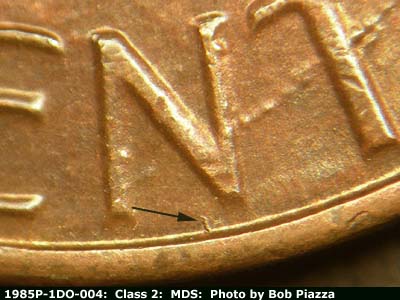 Die-stage B marker on 1985P•1DO•004 (1985 Doubled Die Obverse).