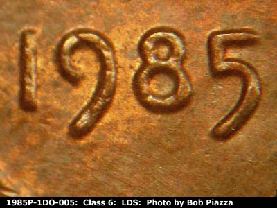 Die-stage C marker on 1985P•1DO•005 (1985 Doubled Die Obverse).