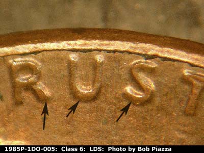 Die-stage C marker on 1985P•1DO•005 (1985 Doubled Die Obverse).