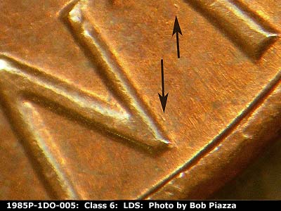 Die-stage C marker on 1985P•1DO•005 (1985 Doubled Die Obverse).