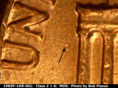Die-stage B marker on 1985P•1DR•001 (1985 Doubled Die Reverse).