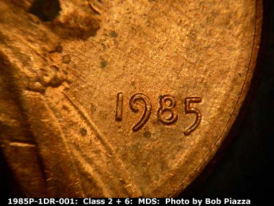 Die-stage B marker on 1985P•1DR•001 (1985 Doubled Die Reverse).