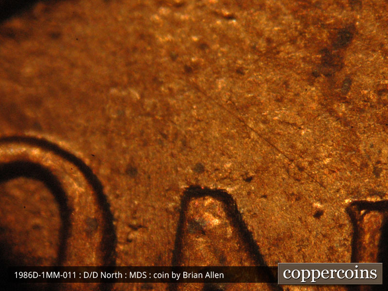 Die-stage B marker on 1986D•1MM•011 (1986 Repunched Mint Mark).