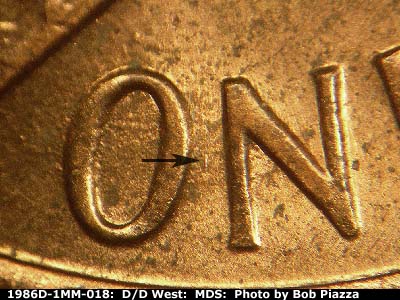 Die-stage B marker on 1986D•1MM•018 (1986 Repunched Mint Mark).
