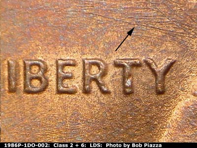 Die-stage C marker on 1986P•1DO•002 (1986 Doubled Die Obverse).