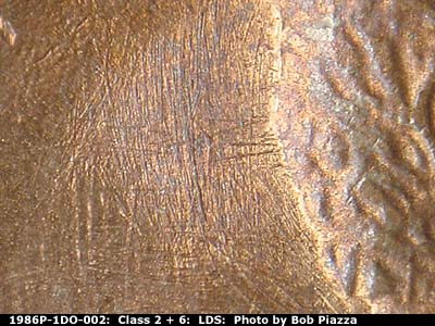 Die-stage C marker on 1986P•1DO•002 (1986 Doubled Die Obverse).