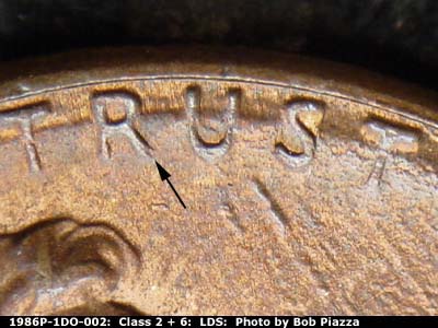 Die-stage C marker on 1986P•1DO•002 (1986 Doubled Die Obverse).