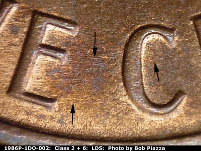Die-stage C marker on 1986P•1DO•002 (1986 Doubled Die Obverse).