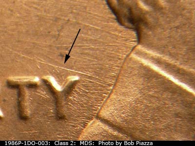 Die-stage B marker on 1986P•1DO•003 (1986 Doubled Die Obverse).