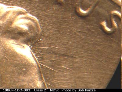 Die-stage B marker on 1986P•1DO•003 (1986 Doubled Die Obverse).