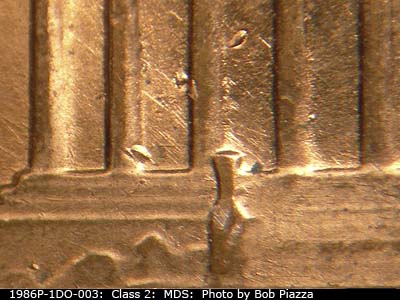 Die-stage B marker on 1986P•1DO•003 (1986 Doubled Die Obverse).