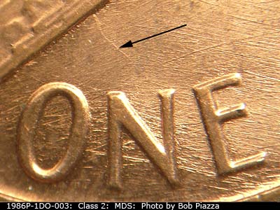 Die-stage B marker on 1986P•1DO•003 (1986 Doubled Die Obverse).