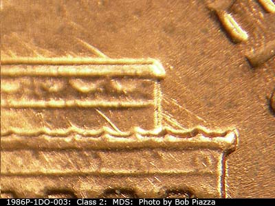 Die-stage B marker on 1986P•1DO•003 (1986 Doubled Die Obverse).