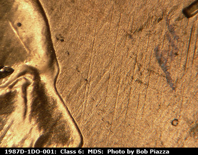 Die-stage B marker on 1987D•1DO•001 (1987 Doubled Die Obverse).